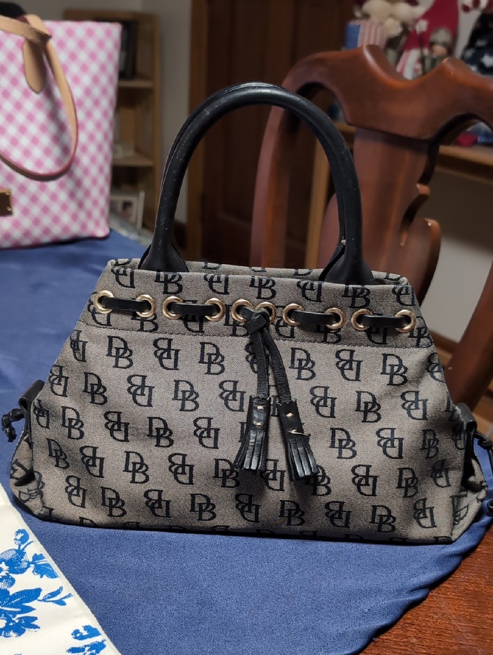 Dooney And Bourke Tapered Tassel Bag in Taupe and Black Coated Cotton.